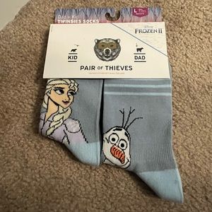 Father and kid marching Frozen socks